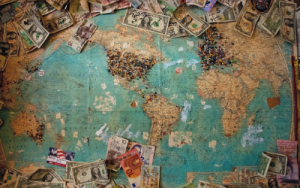 World map with cash on it - Emigration with BOXIE24