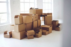 best moving tips - room full of sturdy moving boxes